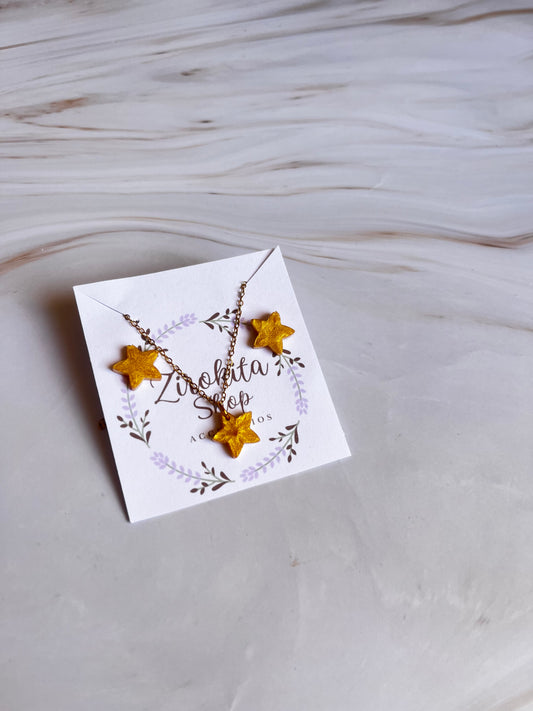 Cunjuntos de resina de estrellas doradas y accesorios dorados.